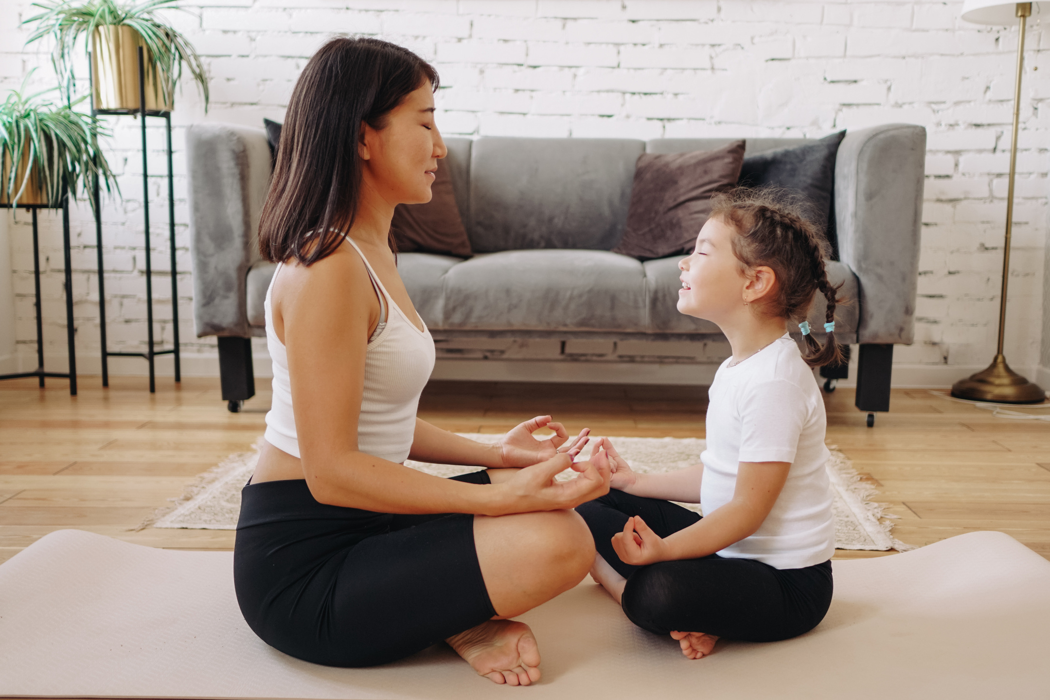Parent and Child Meditating at Home 